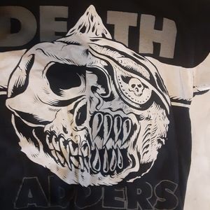 A Miskha Death Adders short sleeved shirt.